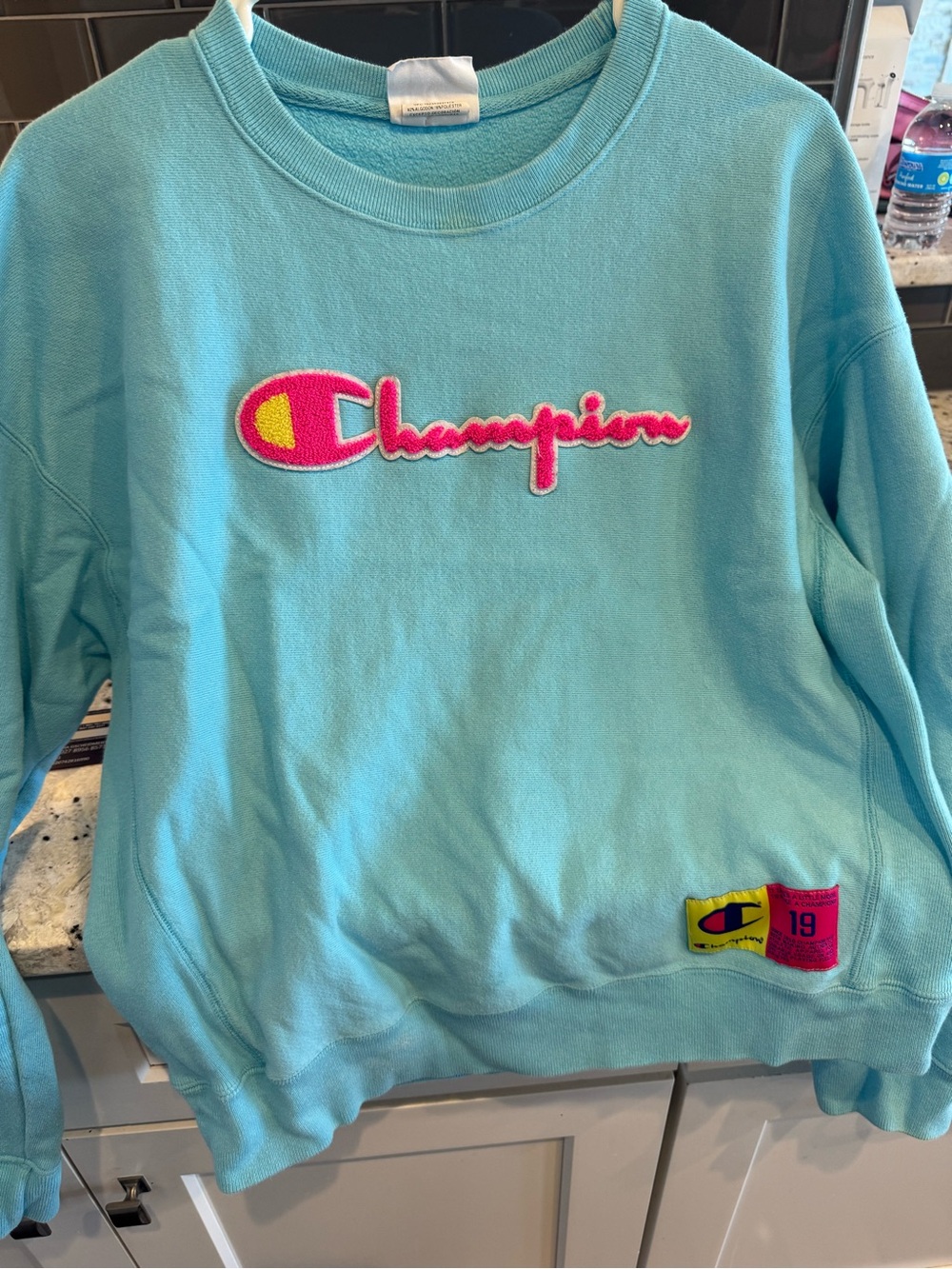 Champion Women's Aqua Crewneck Sweatshirt with Pink & Yellow Logo